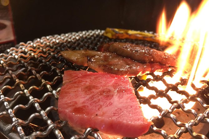 Eat, Drink & Cycle: Osaka Foodie Bike Tour - Getting Started Under Tsutenkaku: Bikes, Helmets, and That First Snack Stop