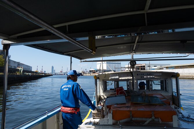 Half day Osaka Bay Area Cycling with E-Assist Bicycle Tour - Black Rain factory streets and the one-minute ferry rhythm