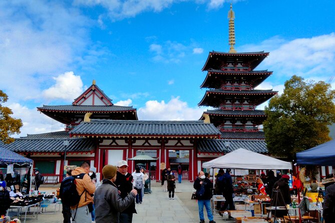 Osaka Castle & Temple Walking Tour with Multilingual Audio Guide - Isshinji Temple and Sanzenbuddha Hall: Statues With a Reason