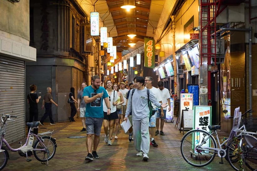 Osaka: Dark Side of Osaka Night Walking Tour - Nishinari at night: gritty origins, shifting crowds, real local energy