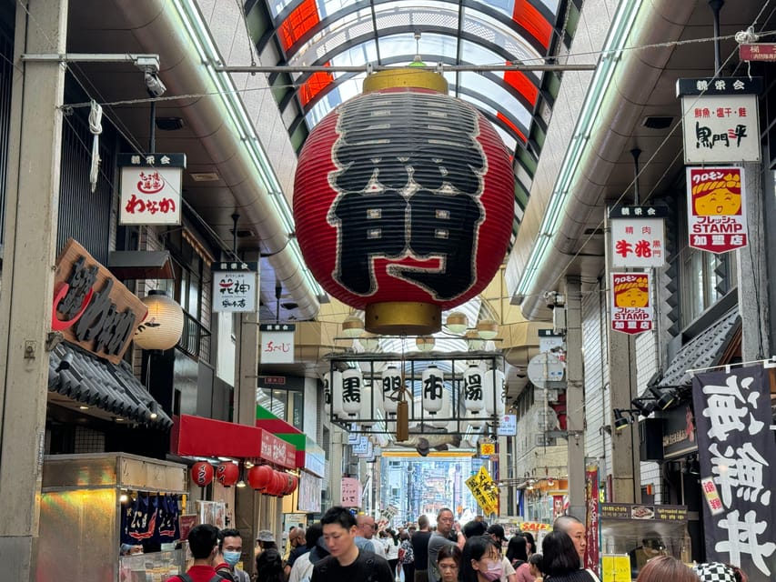 Osaka: Kuromon Market 1.5-Hour Seafood & Street Food Tour - Where you start: Sennichimae Police Box and a yellow sign