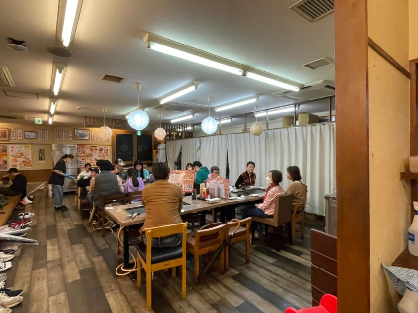 Osaka: Local Foodie Tour in Dotonbori and Shinsekai - Okonomiyaki in Dotonbori: sitting down to cook and eat