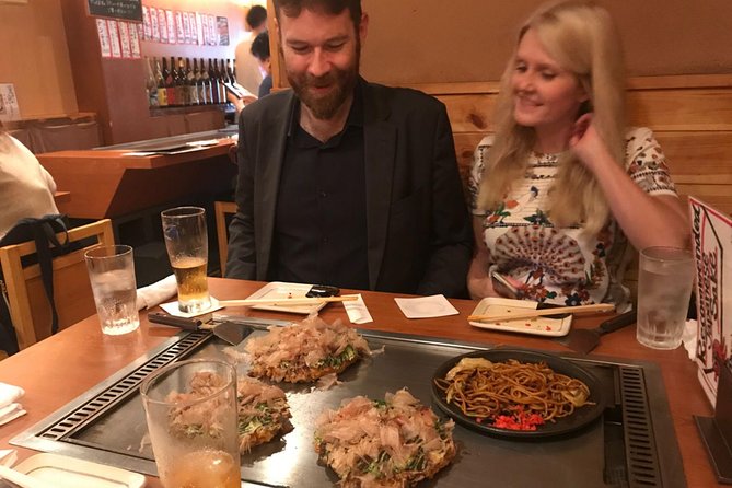 Osaka Local Foodie Walking Tour in Dotonbori and Shinsekai - Stop-by-Stop: Tsutenkaku, Alley Eats, and the Glico Photo Finish