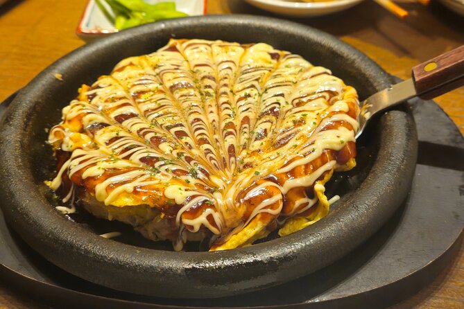 Osaka: Shinsekai Food Tour - 13 Dishes at 5 Local Eateries - Stop 2: Shinsekai retro streets and the Tsutenkaku backdrop you’ll keep seeing