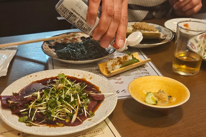 Osaka: Shinsekai Food Tour - 13 Dishes at 5 Local Eateries - Stop 4: Tsutenkaku for the quick photo-and-signature ending