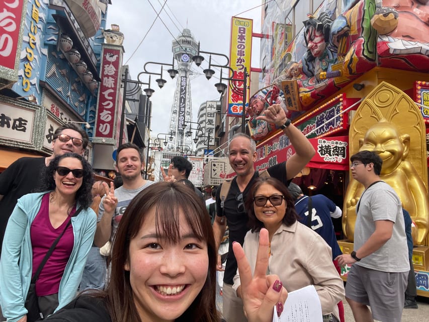 Osaka: Walking Tour and Top Highlights - Dotonbori: neon lights and photo opportunities at the finish line